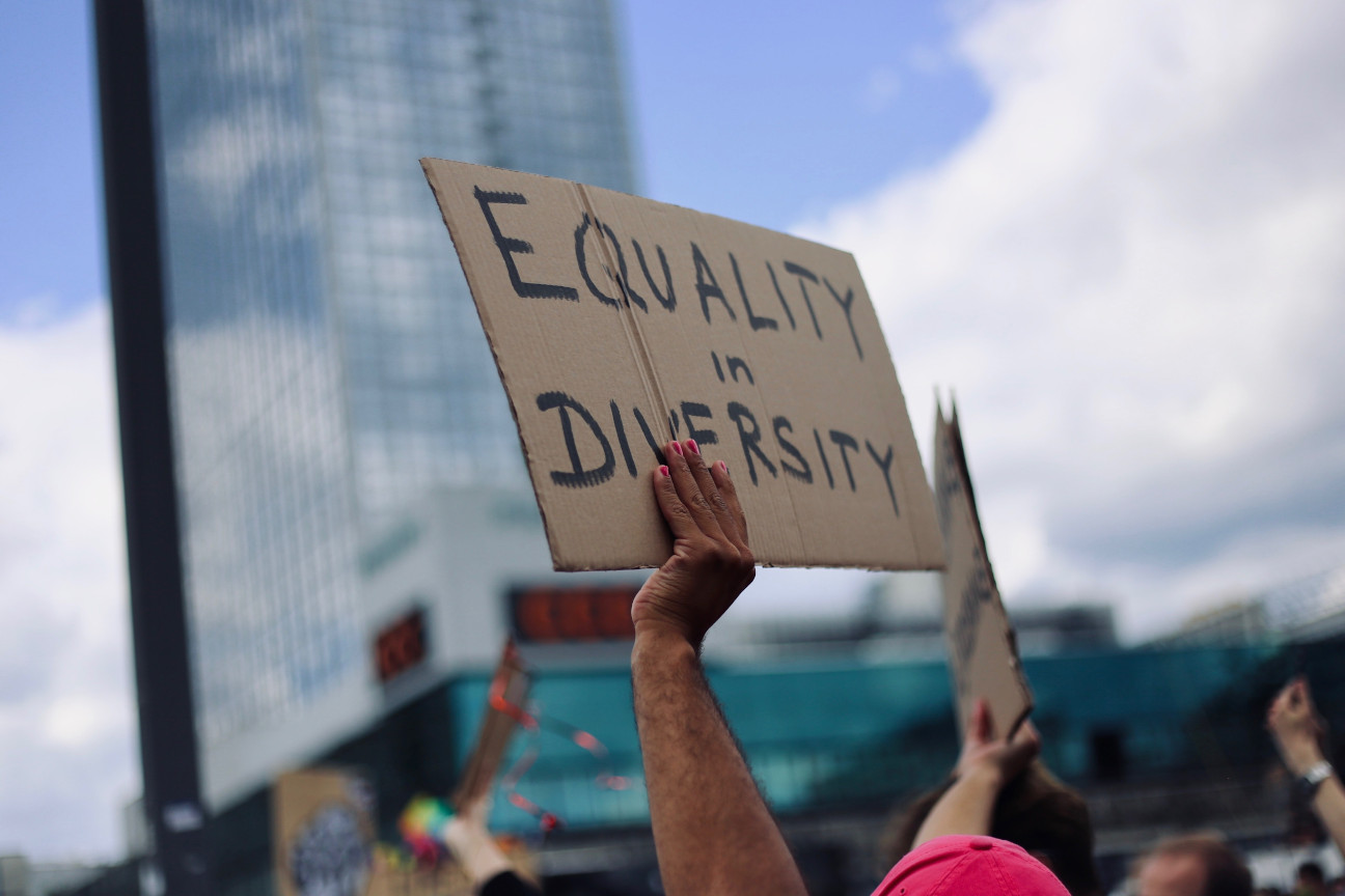 Equality in Diversity Amy Elting UnSplash Cardboard sign with the handwritten words Equality in Diversity